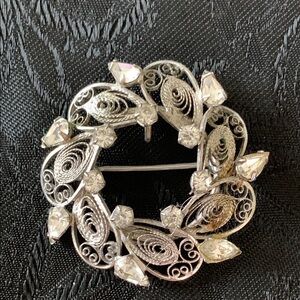 Ornate Sterling Filigree Brooch with Intricate Scrollwork and Sparkling Crystals